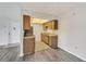 Cozy kitchen with stainless appliances next to living area and front door at 5800 Hollywood Blvd # 312, Sarasota, FL 34231
