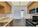 Open kitchen layout with stainless appliances and an adjacent pantry at 5800 Hollywood Blvd # 312, Sarasota, FL 34231