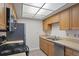 Bright kitchen with light wood cabinets and stainless steel appliances at 5800 Hollywood Blvd # 312, Sarasota, FL 34231