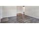 Living room with closet, gray flooring, and white door at 5800 Hollywood Blvd # 312, Sarasota, FL 34231