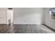 Spacious living room with sleek gray flooring and bright natural light at 5800 Hollywood Blvd # 312, Sarasota, FL 34231