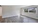 Inviting living room with large window showcasing scenic views and stylish gray flooring at 5800 Hollywood Blvd # 312, Sarasota, FL 34231