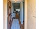 Inviting entryway with hardwood floors, a stylish rug, and a glimpse into the living space at 6218 29Th W Ave # 6218, Bradenton, FL 34209