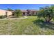 Charming single-story home with well-maintained lawn and mature palm trees in a vibrant neighborhood at 6218 29Th W Ave # 6218, Bradenton, FL 34209