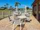 Community patio with tables and chairs with tranquil water view at 6218 29Th W Ave # 6218, Bradenton, FL 34209