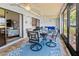 Enclosed patio featuring ceiling fans, neutral furniture, and a sliding door to the interior at 6218 29Th W Ave # 6218, Bradenton, FL 34209