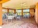 Covered patio with multiple tables and ceiling fans with water views at 6218 29Th W Ave # 6218, Bradenton, FL 34209