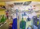 Organized storage room with shelving, cleaning supplies and water heater at 6218 29Th W Ave # 6218, Bradenton, FL 34209