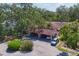 Aerial view of the building with a tile roof and convenient covered parking at 6304 Pelican Dr, Bradenton, FL 34210