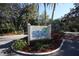 Entrance to Wild Oak Bay community surrounded by manicured tropical landscaping at 6304 Pelican Dr, Bradenton, FL 34210