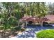 Charming home featuring a carport and a lush, mature landscape that offers natural shade and beauty at 6304 Pelican Dr, Bradenton, FL 34210