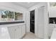 Convenient laundry closet with stacked washer and dryer, maximizing space and functionality in the home at 6304 Pelican Dr, Bradenton, FL 34210