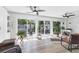 Bright living room with tile floor and sliding glass doors to a private courtyard at 6304 Pelican Dr, Bradenton, FL 34210
