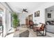 Bright living room with tile floor and sliding glass doors to a private courtyard at 6304 Pelican Dr, Bradenton, FL 34210
