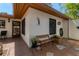 Cozy outdoor patio space featuring a bench, stylish decor, and a relaxing atmosphere for outdoor enjoyment at 6304 Pelican Dr, Bradenton, FL 34210