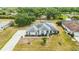 Aerial view of a property with beautiful landscaping, long driveway, and scenic surroundings at 6405 99Th E St, Bradenton, FL 34202