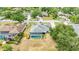 Aerial view shows the pool, lanai and surrounding neighborhood at 6405 99Th E St, Bradenton, FL 34202