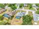 Aerial shot of a home with a screened pool and backyard, mature landscaping, and neighborhood street at 6405 99Th E St, Bradenton, FL 34202
