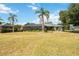 Expansive backyard, showcasing lush greenery and a screened-in pool enclosure at 6405 99Th E St, Bradenton, FL 34202