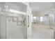 Elegant shower featuring glass doors and a built-in seat, next to soaking tub at 6405 99Th E St, Bradenton, FL 34202
