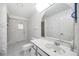 Floral bathroom featuring a single sink vanity, a toilet, and a shower/tub combo at 6405 99Th E St, Bradenton, FL 34202