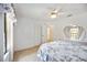 Bedroom featuring neutral carpet, a ceiling fan, and a view of the backyard at 6405 99Th E St, Bradenton, FL 34202