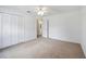 Neutral bedroom with double bi-fold closet doors and a door leading to the bathroom at 6405 99Th E St, Bradenton, FL 34202