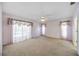Spacious bedroom with large windows providing natural light and neutral carpeting at 6405 99Th E St, Bradenton, FL 34202