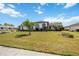 Attractive single-story home with arched entryway, manicured lawn and decorative flower beds at 6405 99Th E St, Bradenton, FL 34202