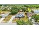 Aerial shot captures a spacious home with mature trees, green lawn, and a long driveway at 6405 99Th E St, Bradenton, FL 34202
