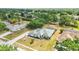 This aerial shot showcases the home's well-kept lawn, mature landscaping, and neighborhood street at 6405 99Th E St, Bradenton, FL 34202