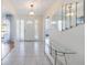 Bright foyer with tile flooring, modern console table, decorative mirrors, and stylish lighting at 6405 99Th E St, Bradenton, FL 34202