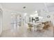 An open kitchen area boasts tiled floors and seamless transition to the breakfast nook and front entry at 6405 99Th E St, Bradenton, FL 34202