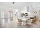 An open kitchen area boasts tiled floors and seamless transition to the breakfast nook and front entry at 6405 99Th E St, Bradenton, FL 34202