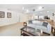 Open-concept living room featuring vaulted ceilings, neutral carpet, and seamless transition to the kitchen at 6405 99Th E St, Bradenton, FL 34202
