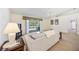 A bright living room with sliding glass doors and a view to the pool at 6405 99Th E St, Bradenton, FL 34202