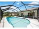 Beautiful backyard pool features a screened enclosure and relaxing outdoor space at 6405 99Th E St, Bradenton, FL 34202