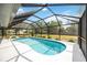 Beautiful pool with screened enclosure, surrounded by manicured landscaping for enjoyment at 6405 99Th E St, Bradenton, FL 34202