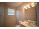 Cozy bathroom featuring a shower and a vanity with a large mirror at 6415 67Th E St, Bradenton, FL 34203