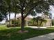 Well-maintained home with mature trees, lush landscaping, and a welcoming exterior at 6415 67Th E St, Bradenton, FL 34203