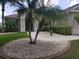 Attractive home exterior with meticulous landscaping and inviting front walkway at 6415 67Th E St, Bradenton, FL 34203