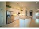 Bright, updated kitchen with white cabinets, stainless steel appliances, and breakfast bar at 6415 67Th E St, Bradenton, FL 34203