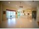 Spacious open-concept living area with high ceilings and sliding glass doors to lanai at 6415 67Th E St, Bradenton, FL 34203