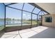 Covered patio with a screen enclosure and views of the adjacent pond at 6415 67Th E St, Bradenton, FL 34203