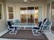 Outdoor dining set on a screened-in patio overlooking the pond at 6415 67Th E St, Bradenton, FL 34203