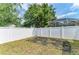 Spacious backyard with a white vinyl fence and lush landscaping at 6546 Blue Grosbeak Cir, Lakewood Ranch, FL 34202