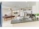 Kitchen and recreation area with granite countertops and stainless steel appliances at 6546 Blue Grosbeak Cir, Lakewood Ranch, FL 34202