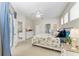 Spacious main bedroom with access to the pool area and a glimpse of the living room, offering seamless indoor-outdoor living at 6546 Blue Grosbeak Cir, Lakewood Ranch, FL 34202