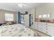 Comfortable main bedroom featuring outdoor access to the pool, providing a refreshing retreat at 6546 Blue Grosbeak Cir, Lakewood Ranch, FL 34202