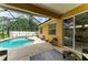 Backyard screened-in pool area featuring a private pool and hot tub, outdoor seating and privacy fence at 6546 Blue Grosbeak Cir, Lakewood Ranch, FL 34202